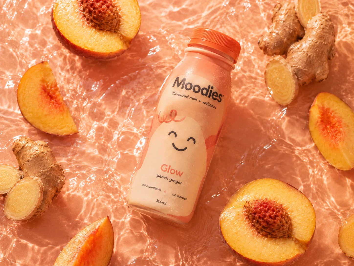 Moodies bottle styled with ingredients, edges dissolved so the liquid fills the frame